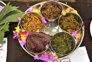 Nachani (ragi) rotis with four wild vegetable dishes